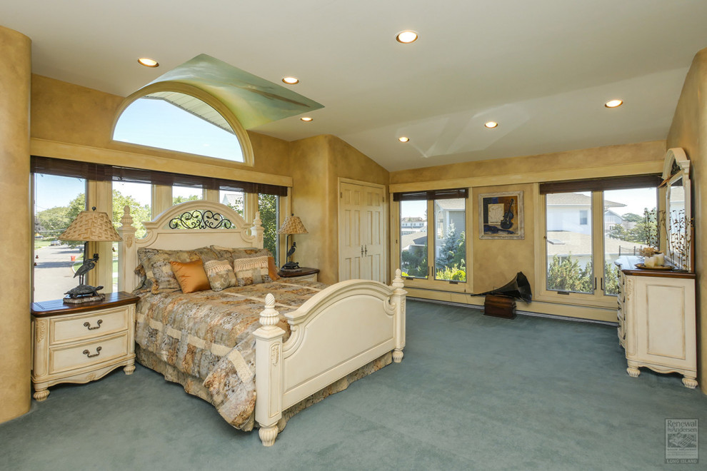 Photo of a large master bedroom in New York with beige walls, carpet, no fireplace and green floor.