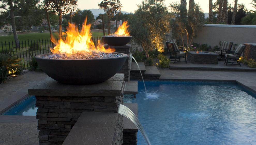 Design ideas for a large contemporary backyard full sun garden in Las Vegas with a fire feature and concrete pavers.