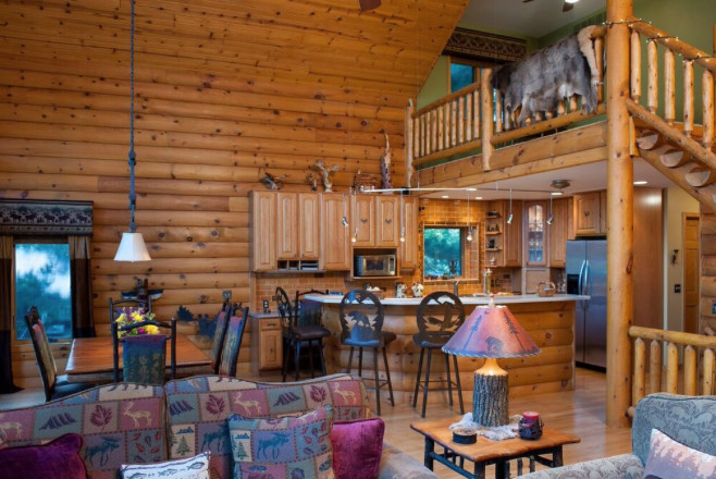 Mountain style kitchen photo in Chicago with brown cabinets and an island