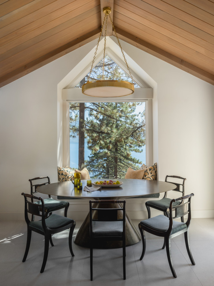 Example of a mountain style porcelain tile, beige floor and exposed beam kitchen/dining room combo design in Other
