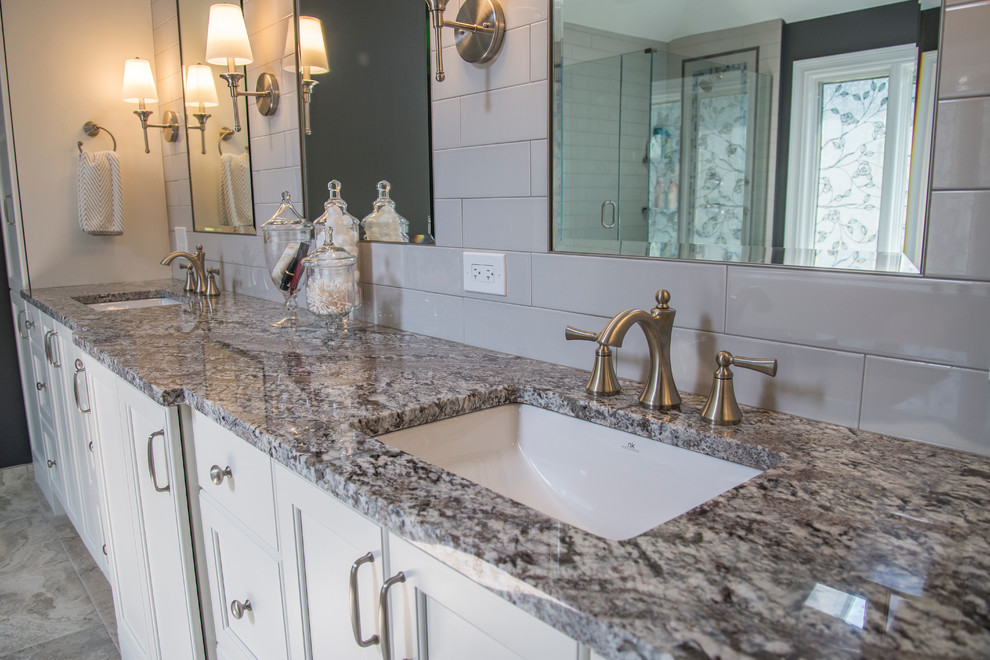 Inspiration for a mid-sized transitional master gray tile and subway tile porcelain tile freestanding bathtub remodel in Chicago with flat-panel cabinets, white cabinets, a two-piece toilet, gray walls, an undermount sink and granite countertops