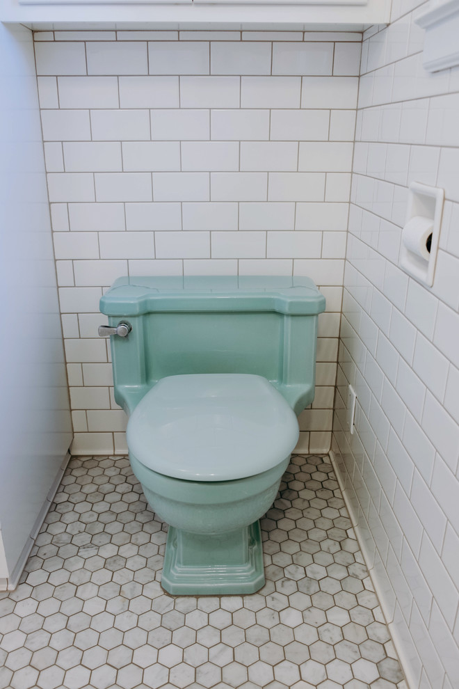 Design ideas for a small midcentury 3/4 bathroom in Seattle with shaker cabinets, white cabinets, an alcove shower, a one-piece toilet, white tile, subway tile, green walls, ceramic floors, a pedestal sink, grey floor and a hinged shower door.