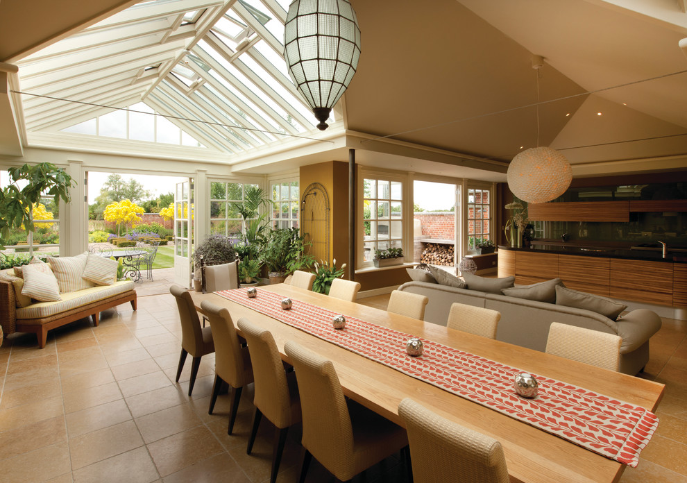 This is an example of a traditional open plan dining in Essex with beige walls.