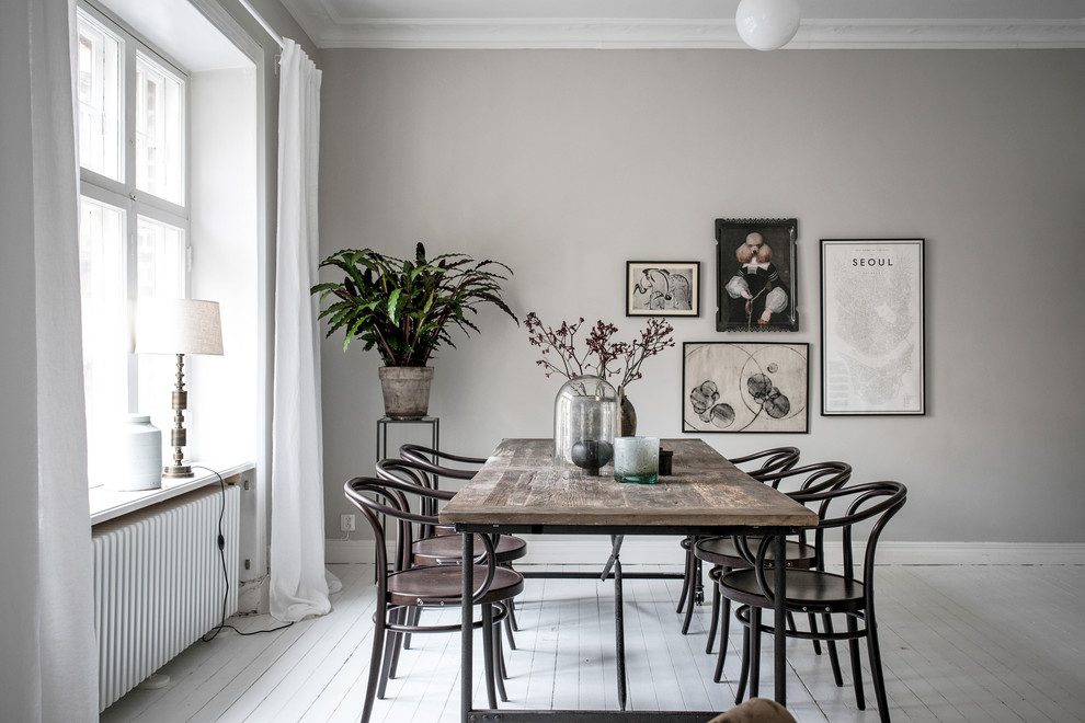 Inspiration for a scandinavian open plan dining in Gothenburg with grey walls, painted wood floors and white floor.