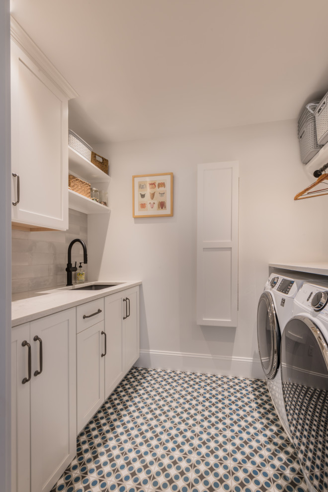 Transitional laundry room photo in Boston