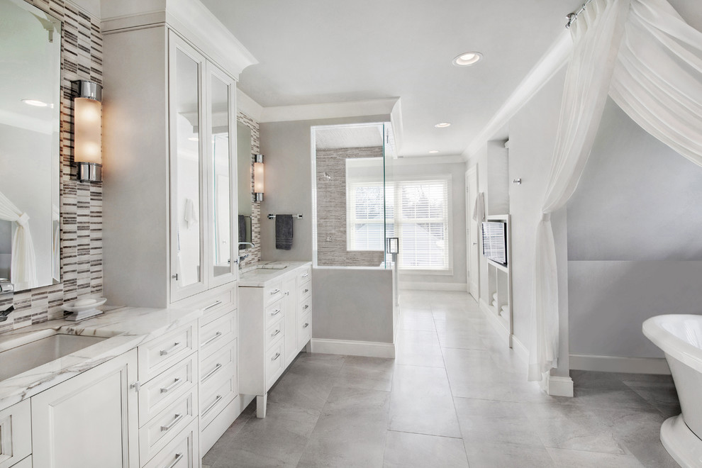 Large transitional master bathroom in Detroit with recessed-panel cabinets, white cabinets, a freestanding tub, an alcove shower, black and white tile, gray tile, mosaic tile, grey walls, ceramic floors, an undermount sink, marble benchtops and grey floor.