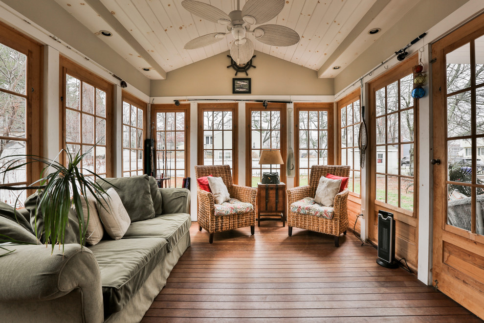 Design ideas for a country sunroom in Boston with dark hardwood floors and a standard ceiling.