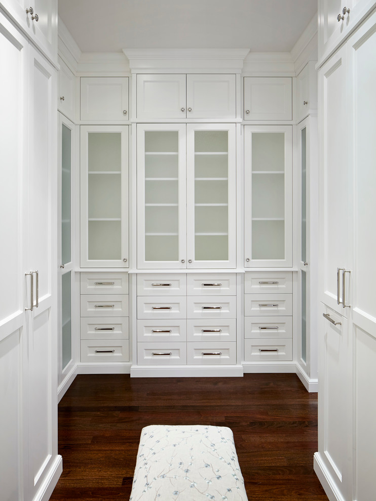 Inspiration for an expansive traditional women's walk-in wardrobe in Chicago with recessed-panel cabinets, white cabinets and dark hardwood floors.