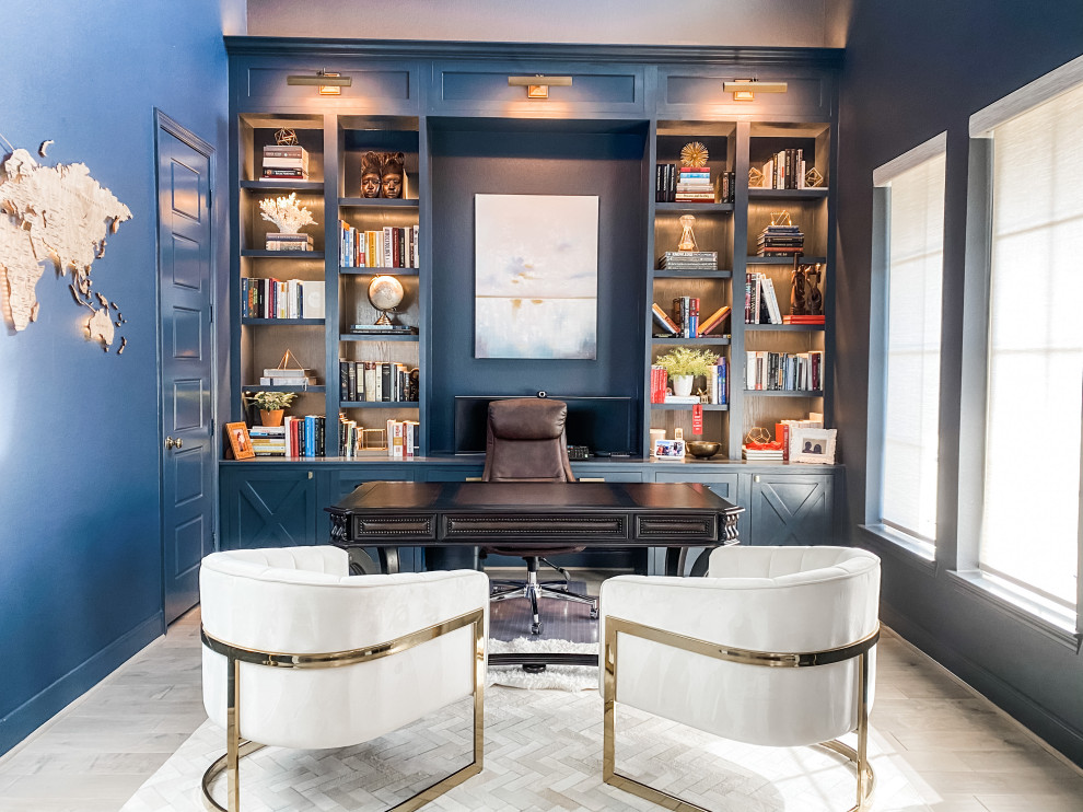 Inspiration for a mid-sized transitional study room in Houston with blue walls, medium hardwood floors, a built-in desk, grey floor and vaulted.