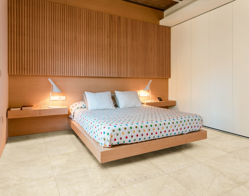 Example of a large minimalist master porcelain tile and beige floor bedroom design in Other