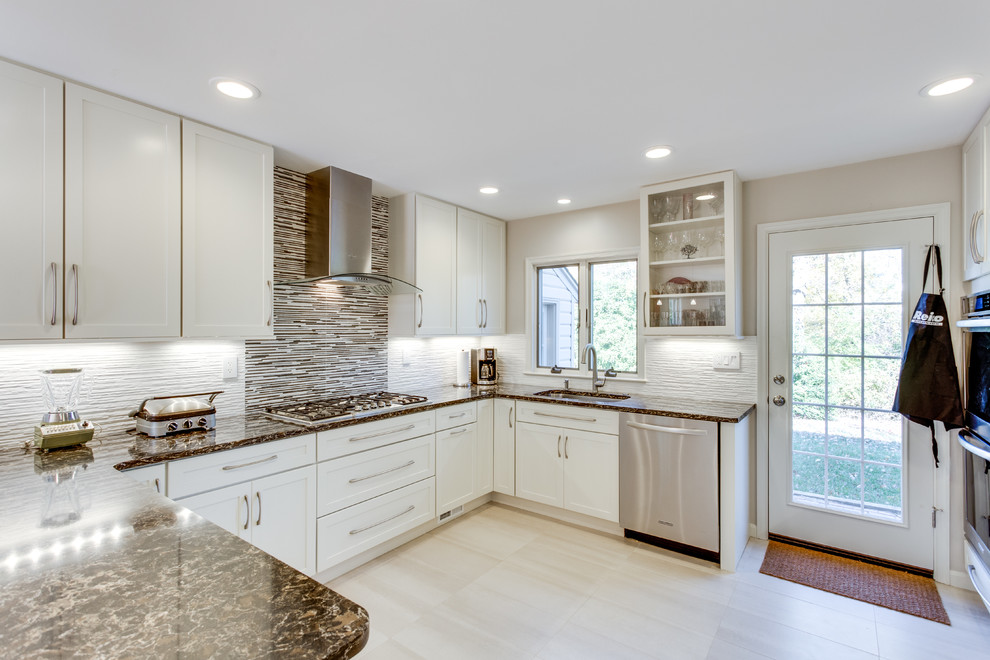 Design ideas for a large transitional u-shaped kitchen in DC Metro with an undermount sink, shaker cabinets, white cabinets, quartz benchtops, stainless steel appliances and a peninsula.