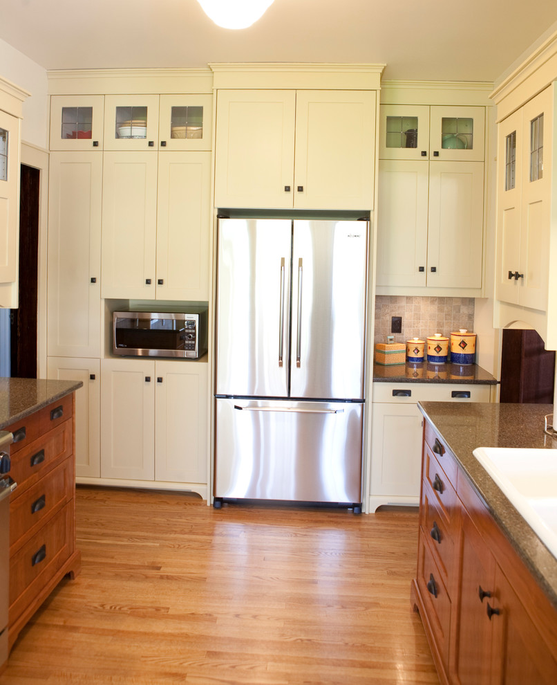 Inspiration for a traditional kitchen in Other with a drop-in sink, shaker cabinets and stainless steel appliances.