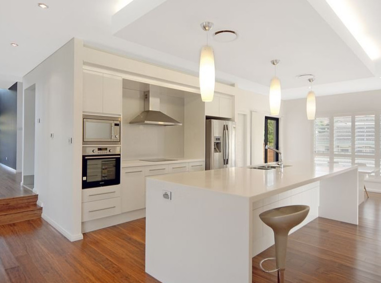 This is an example of a beach style kitchen in Sydney.