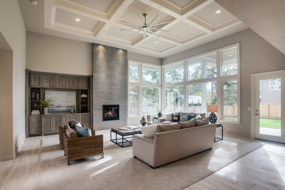Photo of a transitional living room in Portland with grey walls, a standard fireplace and a tile fireplace surround.