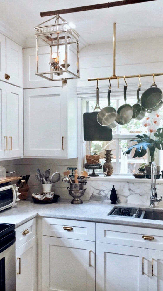 Inspiration for a small enclosed kitchen remodel with a double-bowl sink, shaker cabinets, white cabinets, marble countertops, white backsplash, stainless steel appliances and no island