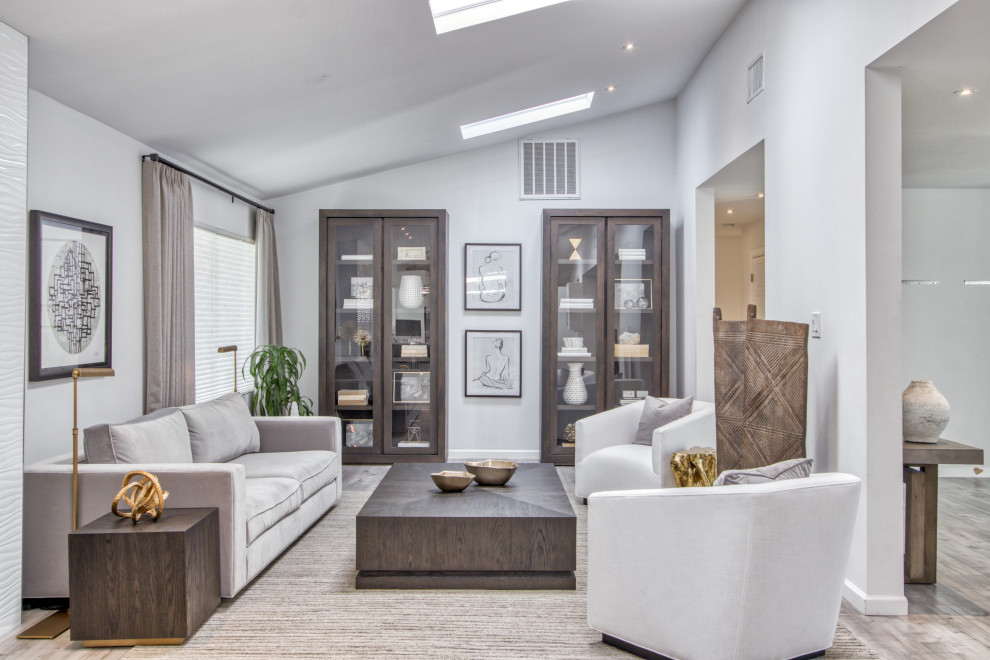 Inspiration for a large transitional formal enclosed living room in Austin with grey walls, no tv and grey floor.