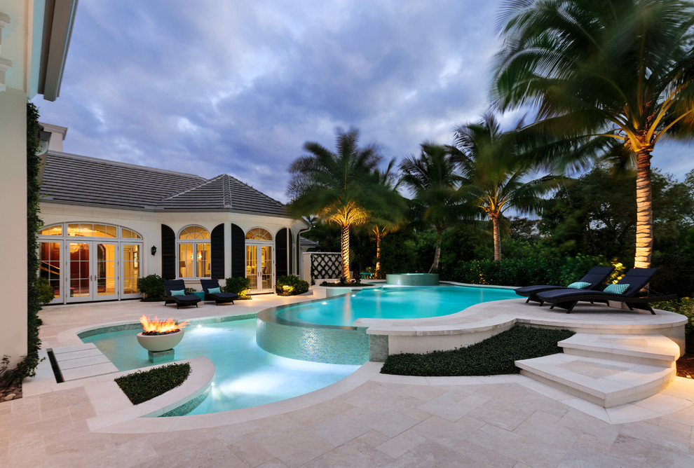 Photo of a transitional backyard kidney-shaped lap pool in Miami.