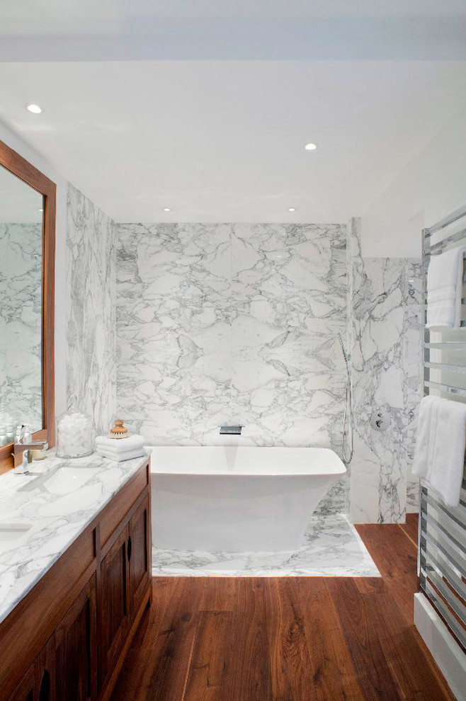 Inspiration for a mid-sized transitional bathroom in London with marble.