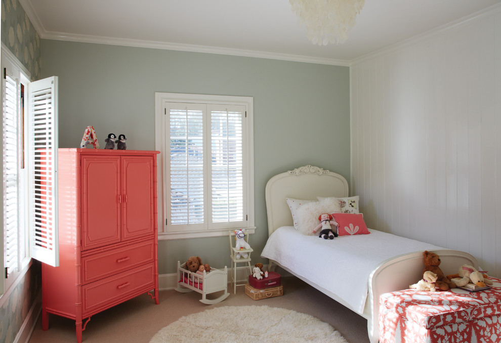 Inspiration for a traditional kids' room for girls in Los Angeles with blue walls and carpet.