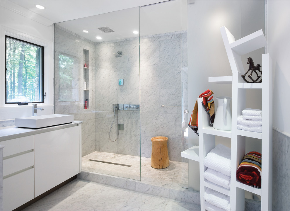 Photo of a mid-sized contemporary master bathroom in DC Metro with a vessel sink, flat-panel cabinets, white cabinets, an alcove shower, white tile, marble benchtops, white walls, marble floors, marble, grey floor, a sliding shower screen and grey benchtops.