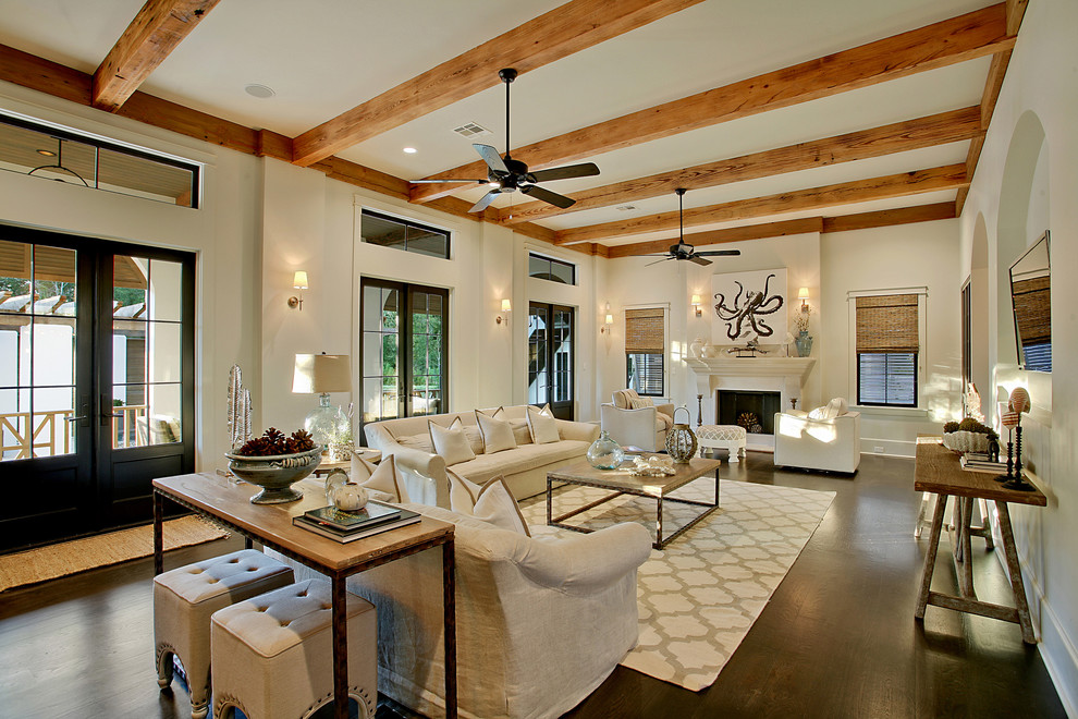 Design ideas for an expansive mediterranean living room in New Orleans with beige walls and a standard fireplace.