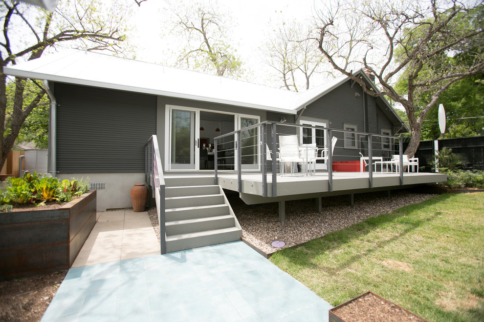 Design ideas for a small contemporary one-storey grey exterior in Austin with wood siding.
