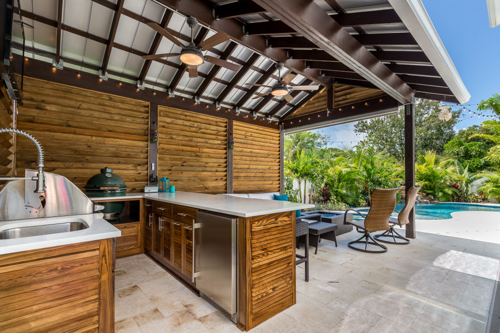 This is an example of a beach style patio in Tampa.