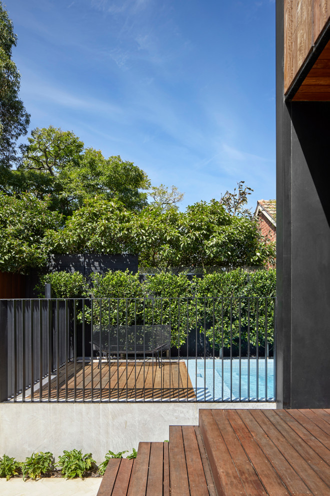 Design ideas for a mid-sized contemporary aboveground pool in Melbourne with with a pool and brick pavers.