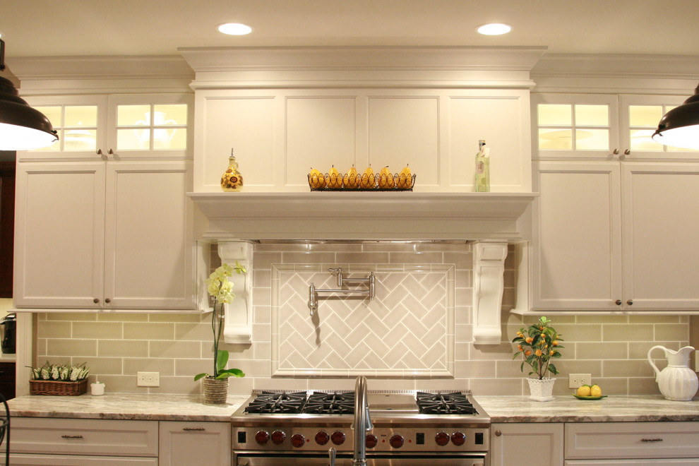 Large transitional l-shaped medium tone wood floor open concept kitchen photo in Cincinnati with an undermount sink, flat-panel cabinets, white cabinets, granite countertops, gray backsplash, subway tile backsplash, stainless steel appliances and an island