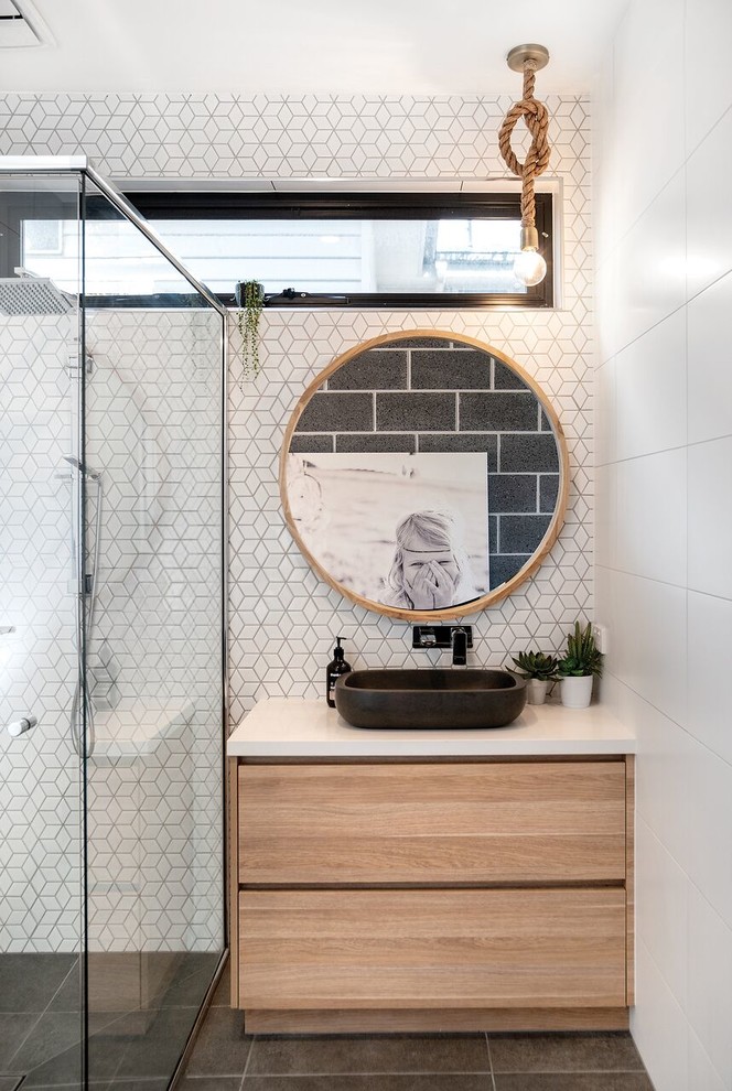 This is an example of a small beach style kids bathroom in Other with light wood cabinets, a corner shower, white tile, mosaic tile, white walls, porcelain floors, a vessel sink, engineered quartz benchtops, grey floor, white benchtops and flat-panel cabinets.