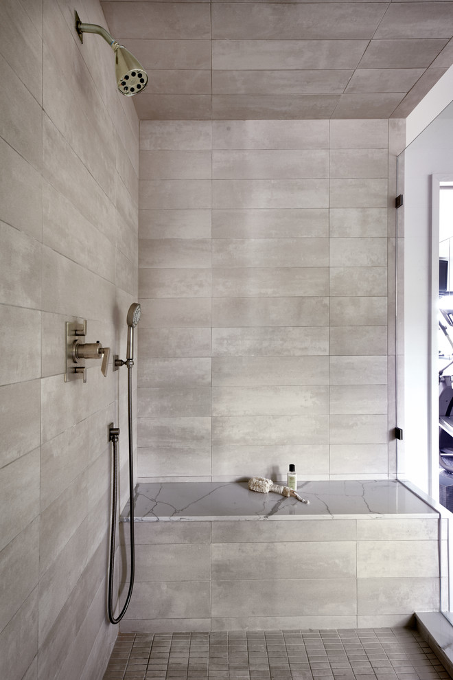 Design ideas for a large transitional master bathroom with shaker cabinets, medium wood cabinets, a drop-in tub, an alcove shower, a one-piece toilet, white tile, limestone, white walls, porcelain floors, a drop-in sink, engineered quartz benchtops, beige floor, a hinged shower door and white benchtops.