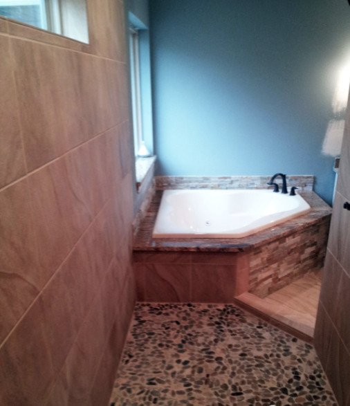 Drop-in bathtub - large transitional master beige tile beige floor drop-in bathtub idea in Austin with shaker cabinets, dark wood cabinets and beige walls