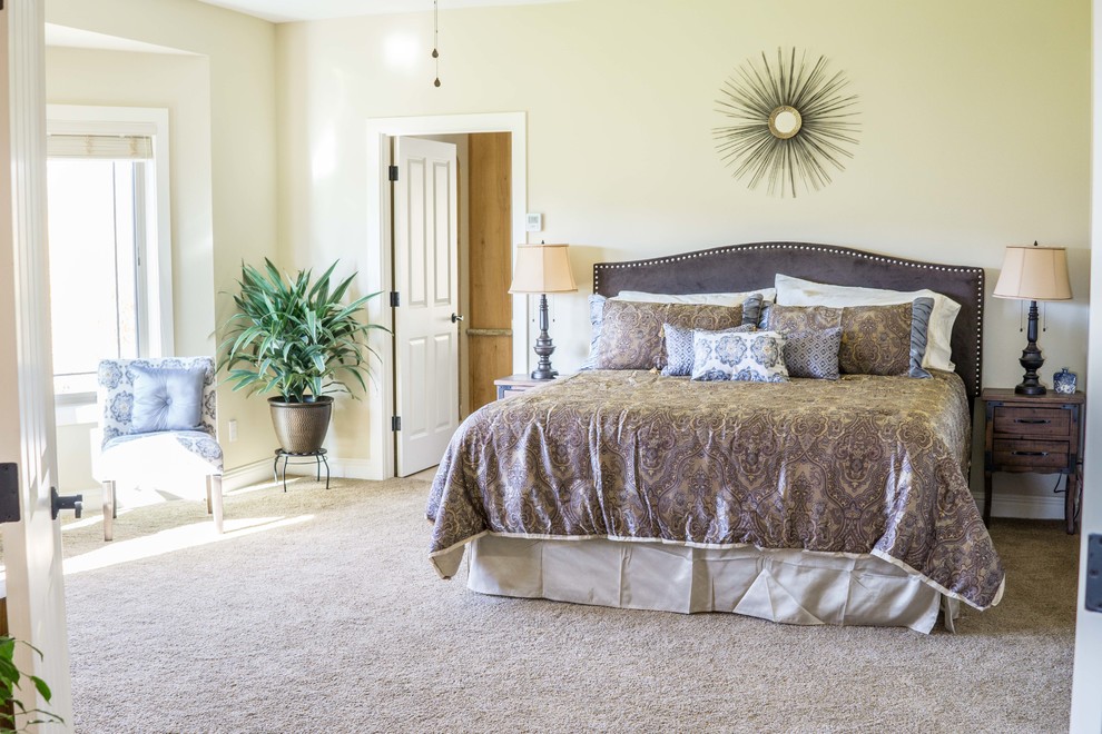 This is an example of a large contemporary master bedroom in Other with beige walls, carpet and beige floor.
