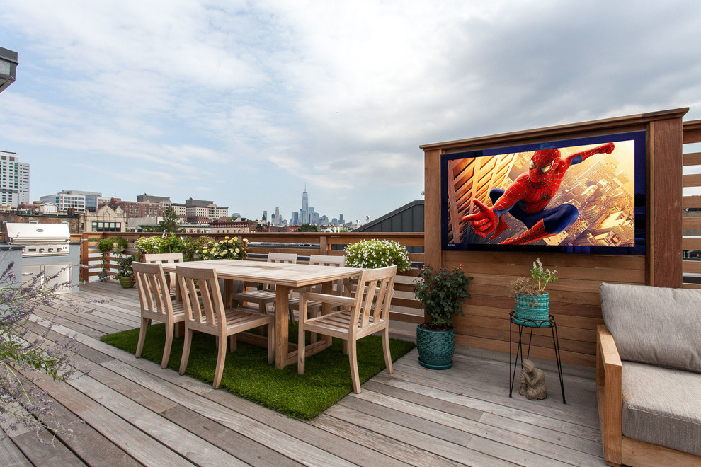 Design ideas for a mid-sized modern rooftop deck in New York with an outdoor kitchen and no cover.