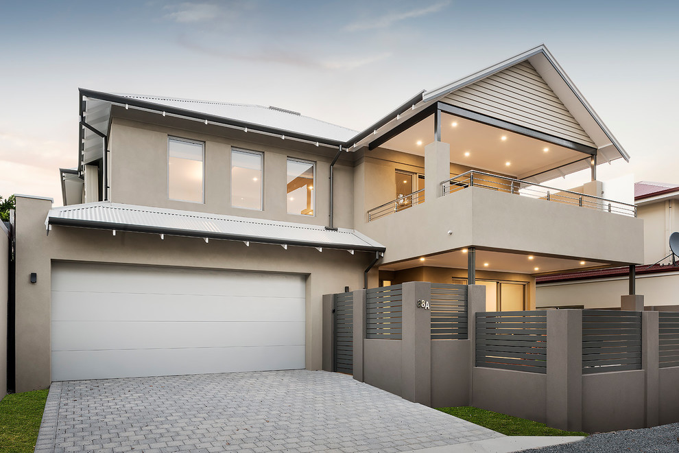This is an example of a contemporary two-storey beige house exterior in Perth with a metal roof.