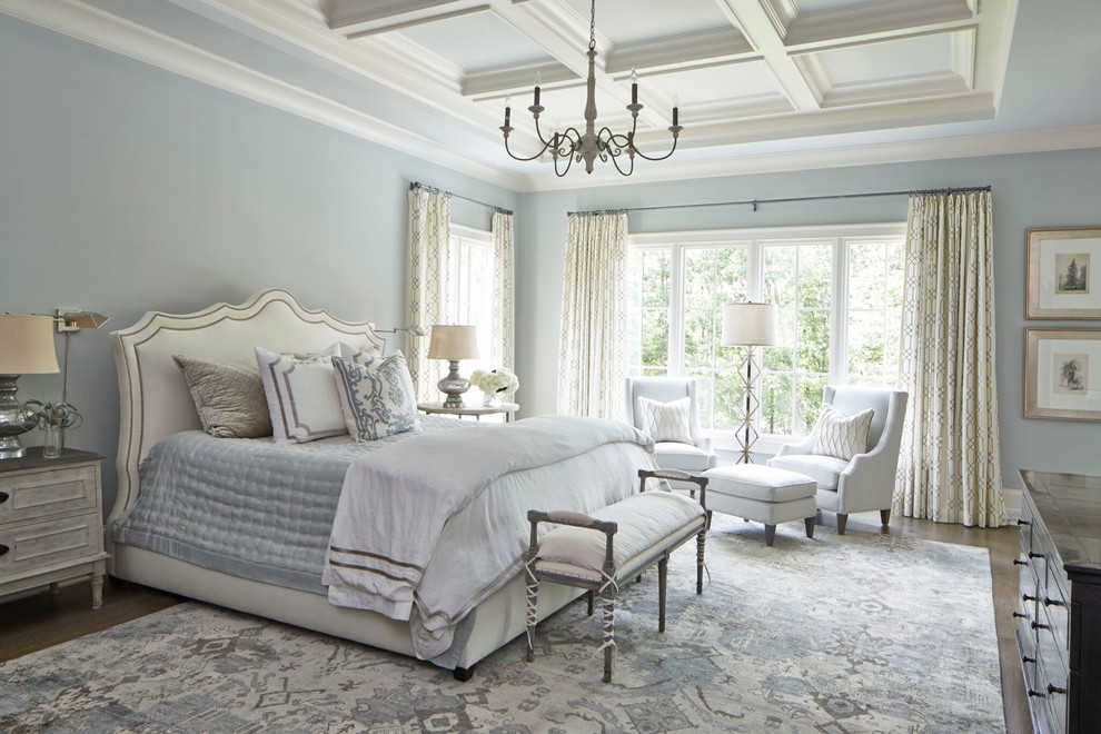 Design ideas for a large transitional master bedroom in Atlanta with blue walls, medium hardwood floors and no fireplace.
