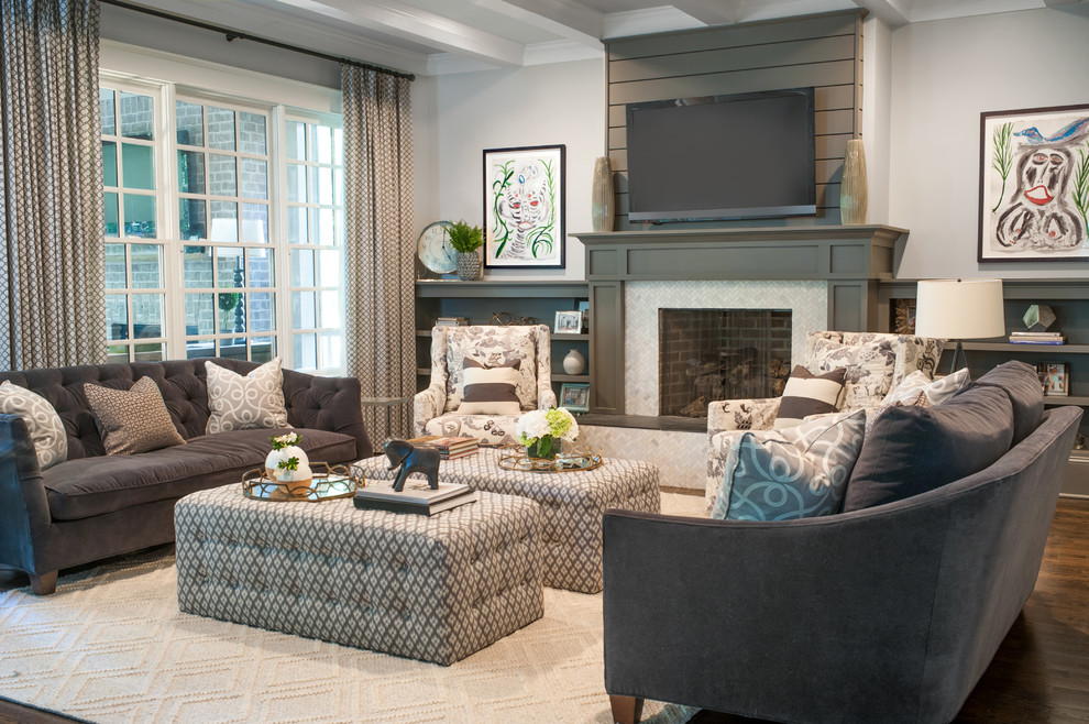 This is an example of a large transitional open concept living room in Atlanta with grey walls, dark hardwood floors, a standard fireplace, a tile fireplace surround, a wall-mounted tv and brown floor.