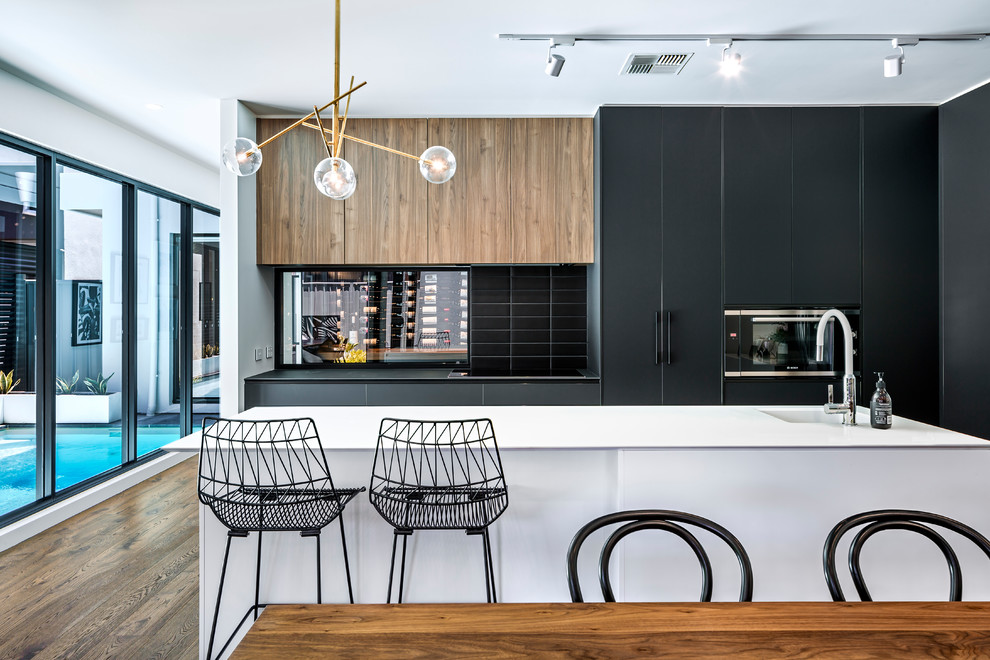 Design ideas for a contemporary kitchen in Adelaide with black cabinets, black splashback and with island.