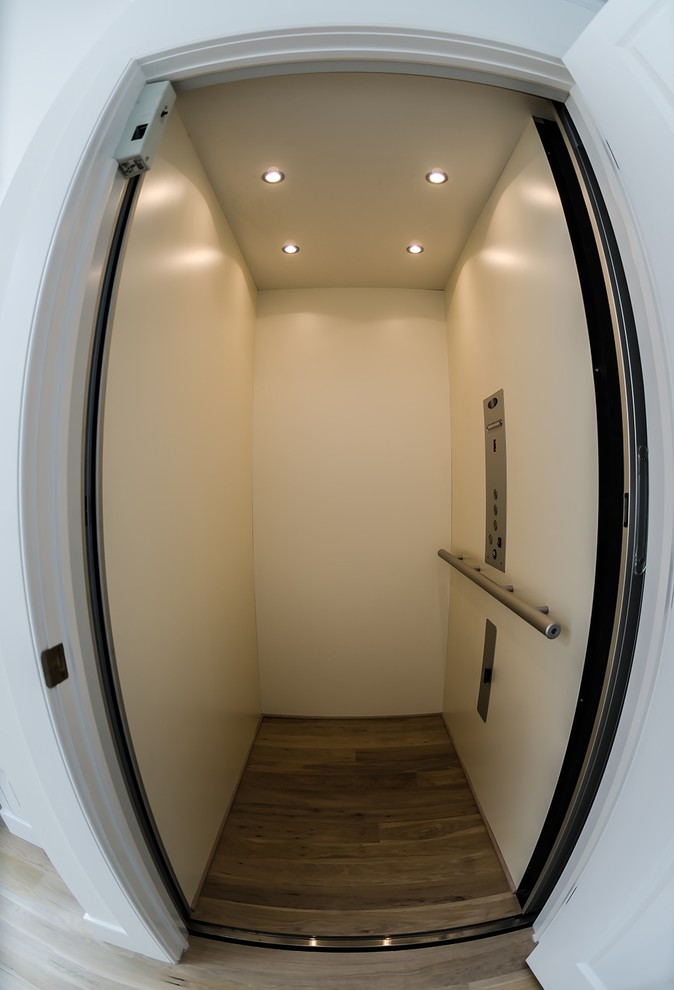 Inspiration for a transitional light wood floor foyer remodel in Bridgeport with beige walls