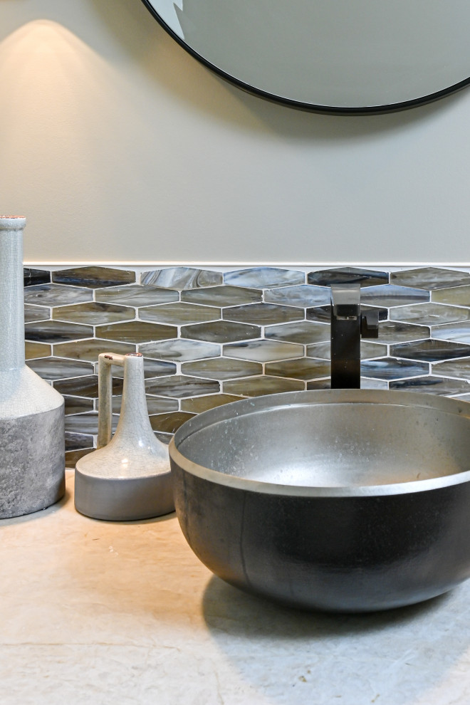 Mid-sized mountain style beige tile dark wood floor and brown floor tub/shower combo photo with a one-piece toilet, gray walls and a drop-in sink
