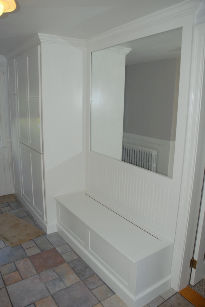 Photo of a mid-sized country mudroom in Boston with white walls, slate floors, a dutch front door and a white front door.