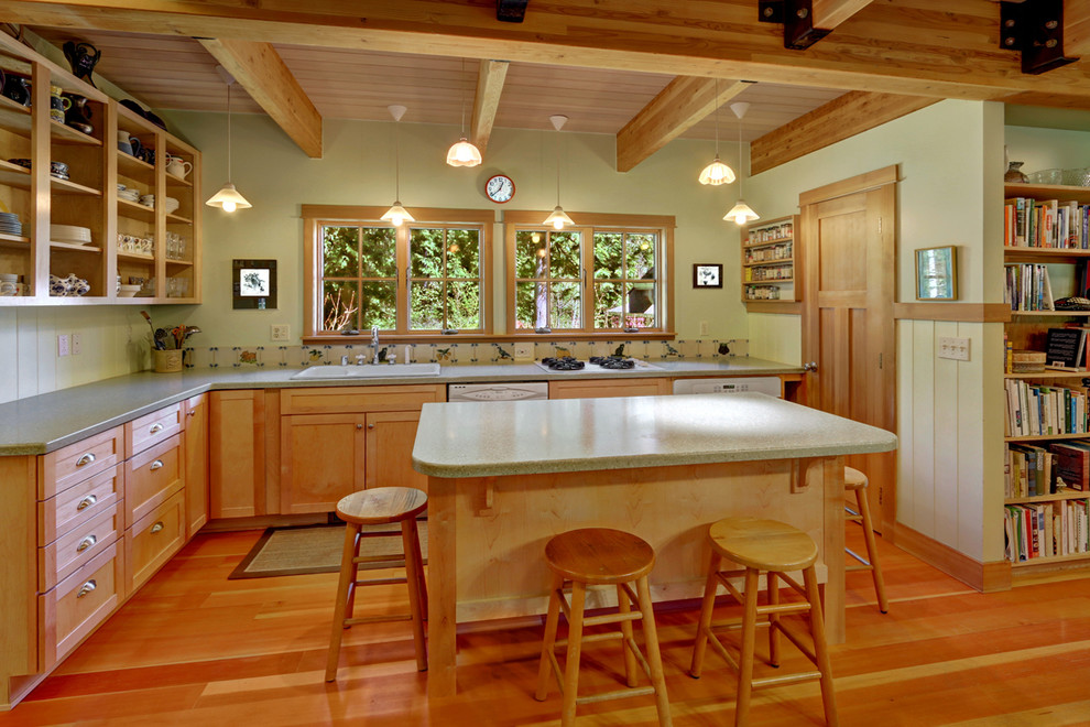 Photo of a mid-sized country l-shaped eat-in kitchen in Seattle with a double-bowl sink, open cabinets, medium wood cabinets, white appliances, medium hardwood floors and with island.