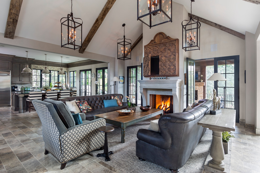 Mid-sized transitional open concept family room in Minneapolis with white walls, a standard fireplace, a concealed tv, ceramic floors, a stone fireplace surround and grey floor.
