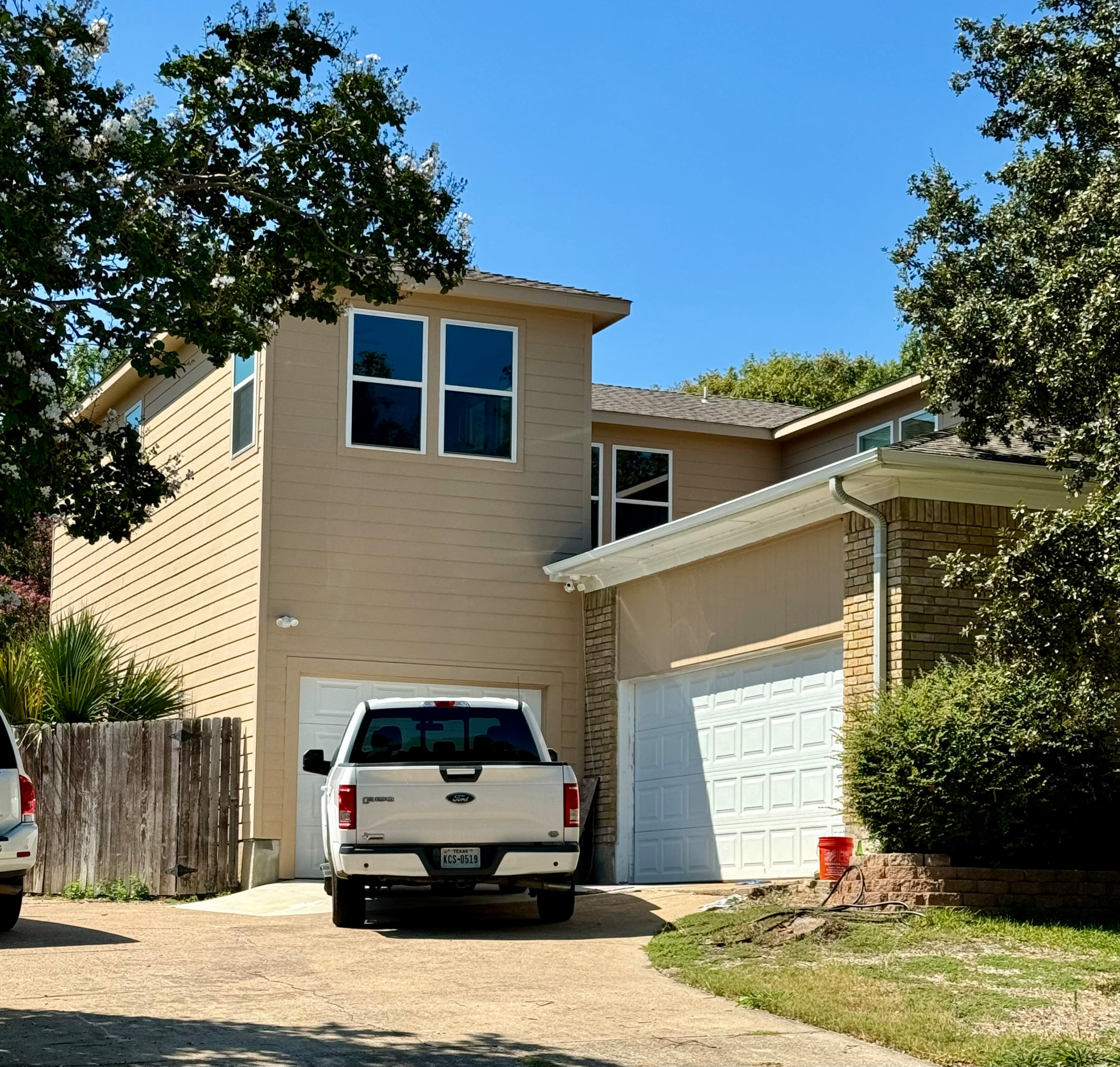 Attached Garage with Second Story - Contemporary Garage Construction Idea in Dallas