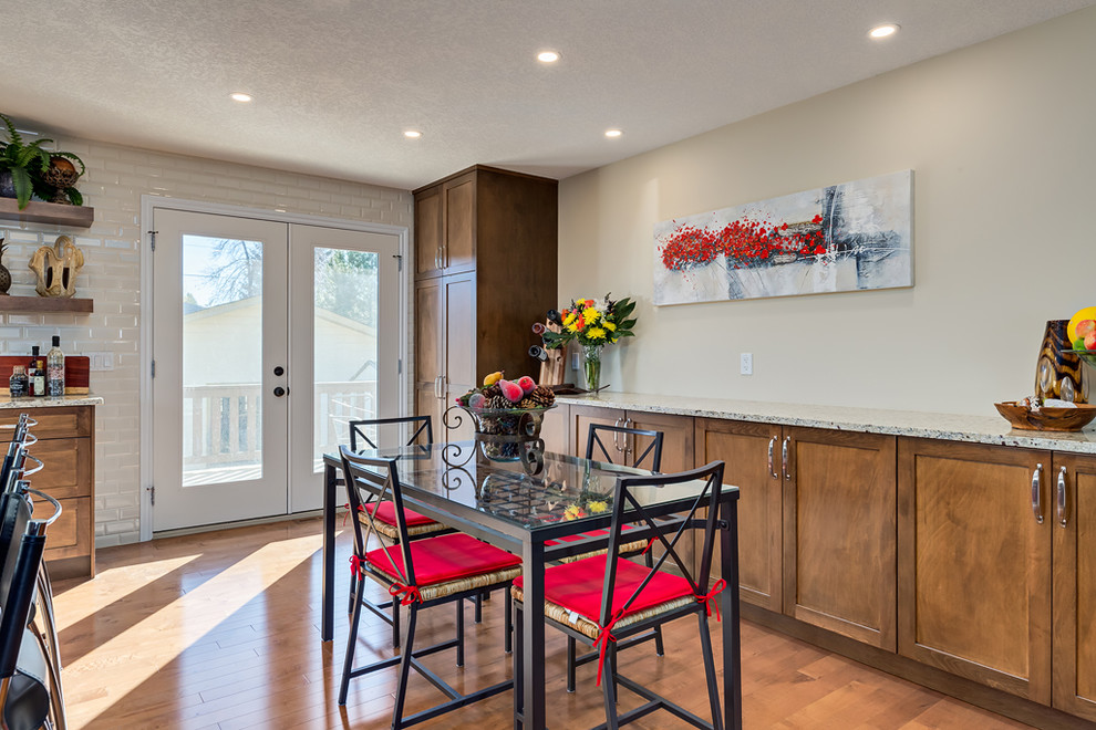 Example of a transitional home design design in Calgary