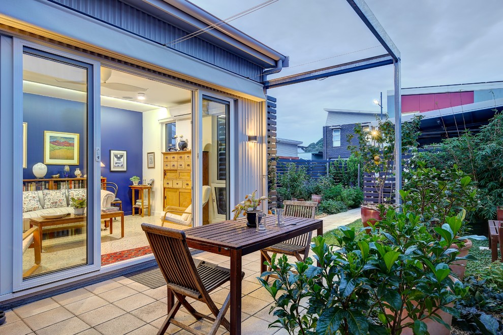 This is an example of an industrial backyard patio in Adelaide with an awning.