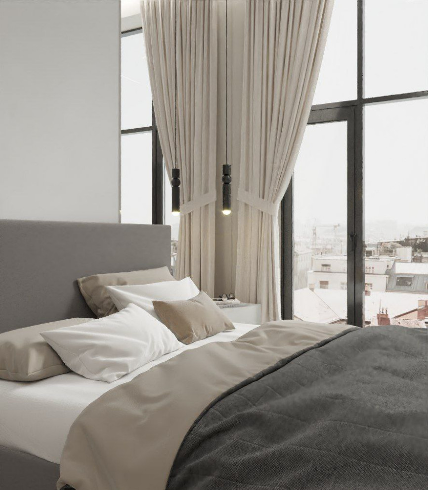 Imagen de dormitorio principal y gris y blanco contemporáneo de tamaño medio con paredes beige, suelo laminado y suelo beige