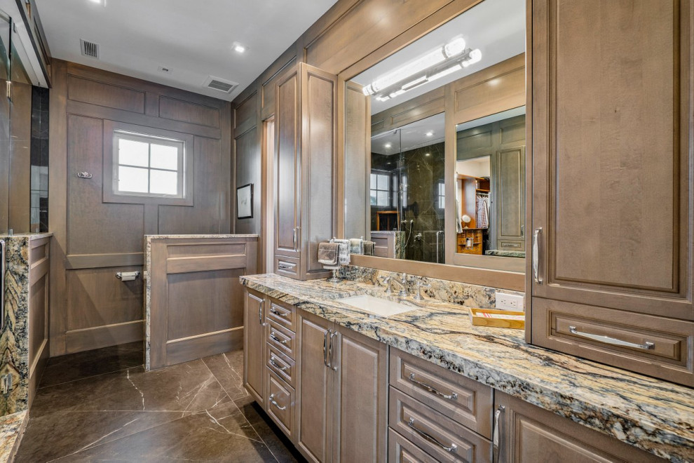 Photo of a large beach style master bathroom in Miami with shaker cabinets, medium wood cabinets, marble floors, an undermount sink, quartzite benchtops, a hinged shower door, multi-coloured benchtops, a single vanity, a built-in vanity, coffered and wood walls.