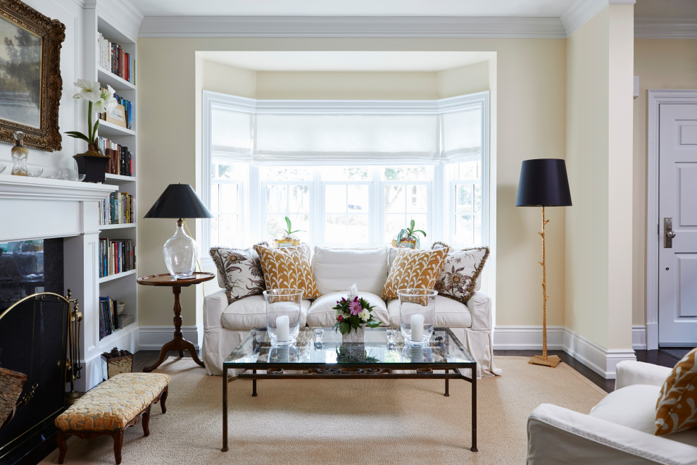 Inspiration for a small timeless open concept dark wood floor and brown floor living room library remodel in Toronto with yellow walls, a standard fireplace, a stone fireplace and no tv