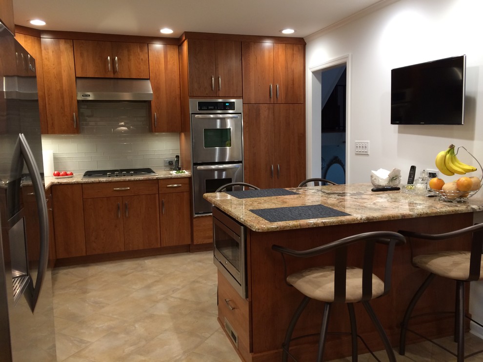 Example of a transitional kitchen design in New York